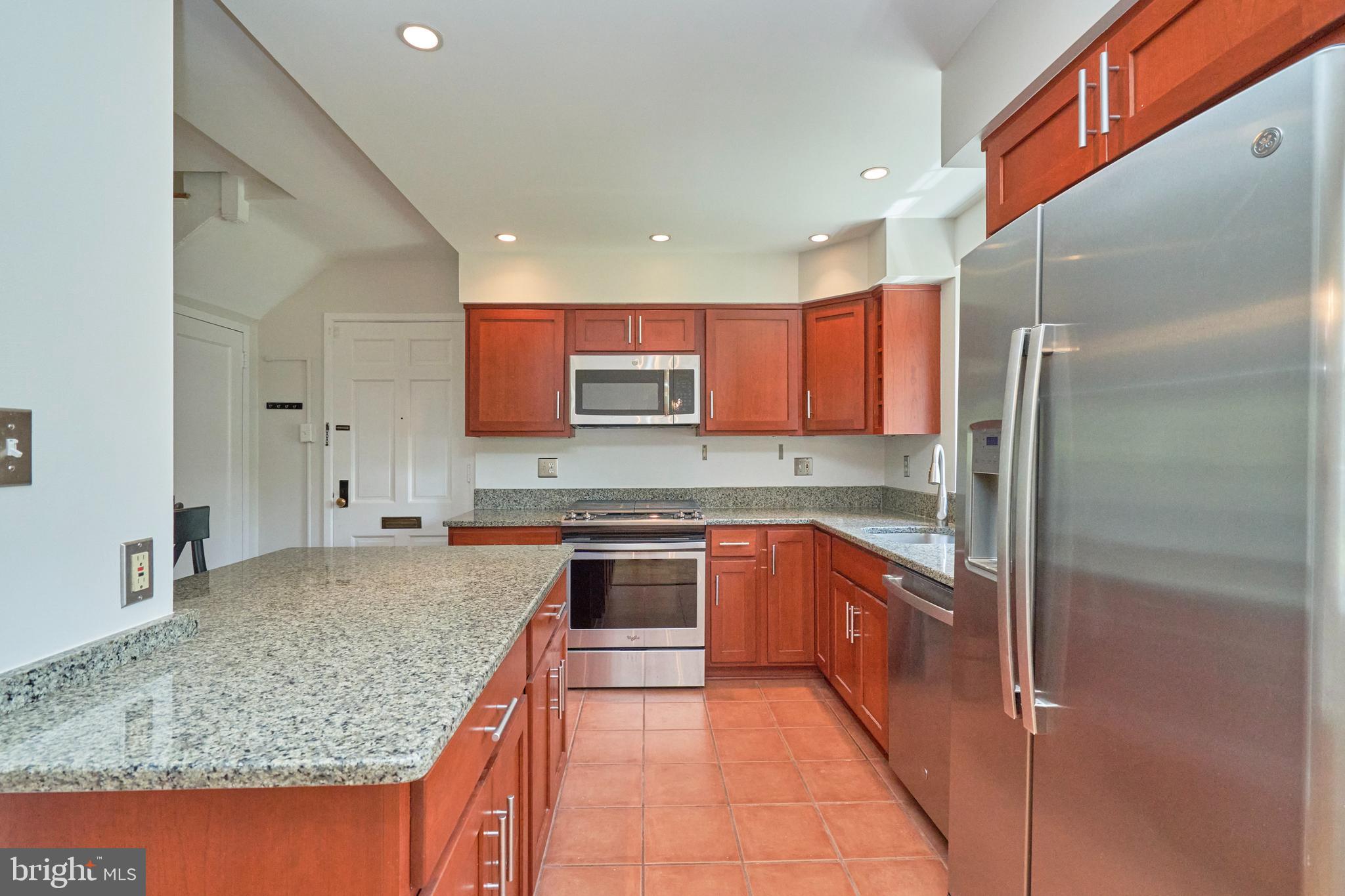 3314 Gunston Road, Unit 7303314 Alexandria, VA 22302 - Photo 6 of 42 Kitchen features granite counters + SS appliances