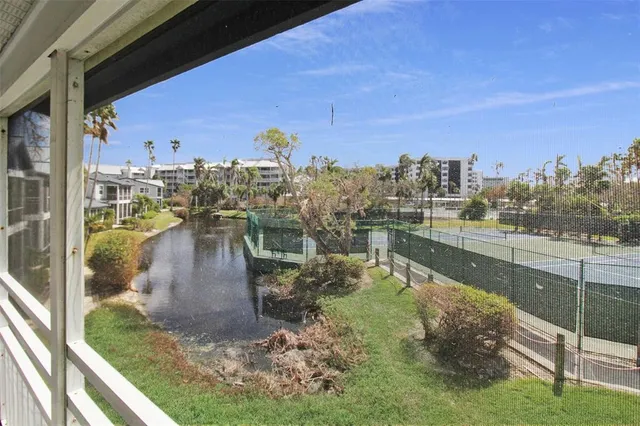 a lake view with a building in the background