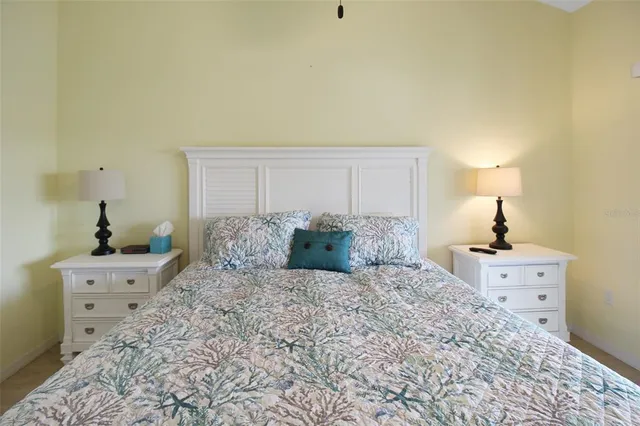 a large bed sitting in a bedroom and dresser