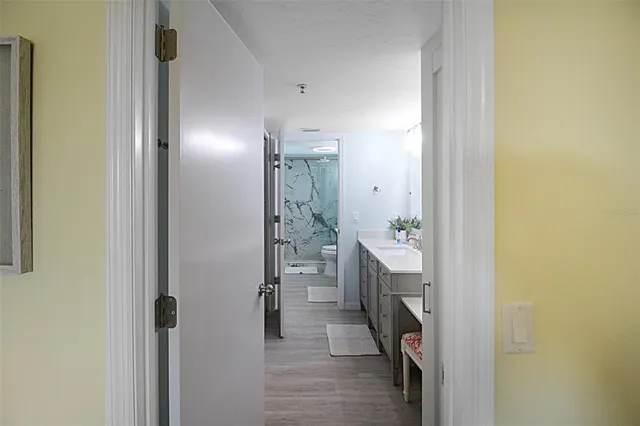 a bathroom with a double vanity sink and mirror