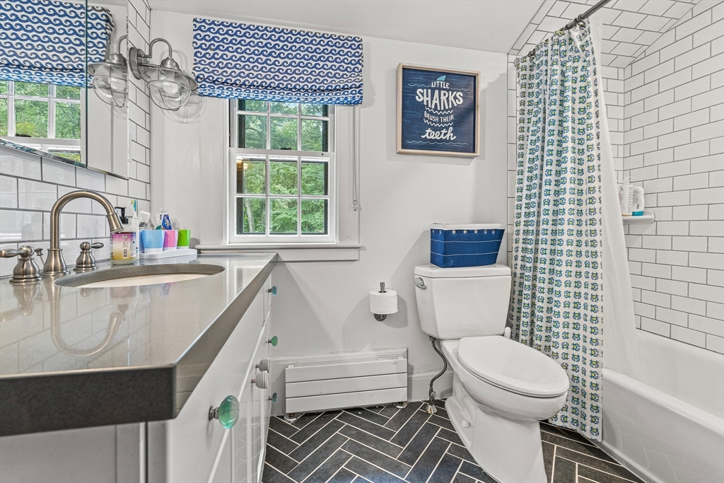 19 Pelham Road Weston, MA 02493 - Photo 13 of 17 a bathroom with a toilet sink and mirror