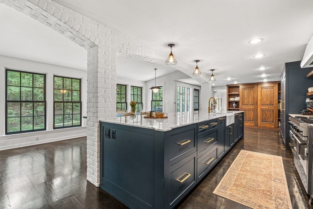 19 Pelham Road Weston, MA 02493 - Photo 2 of 17 a large kitchen with kitchen island granite countertop a large counter top and stainless steel appliances
