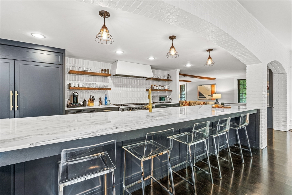 19 Pelham Road Weston, MA 02493 - Photo 3 of 17 a kitchen with stainless steel appliances granite countertop a sink and a refrigerator