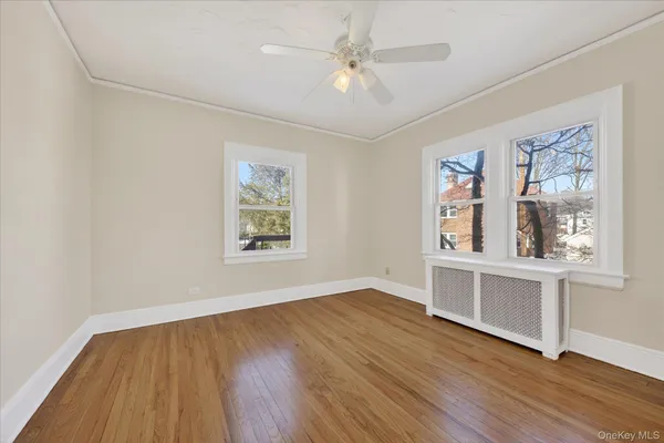 a view of workspace with wooden floor and window