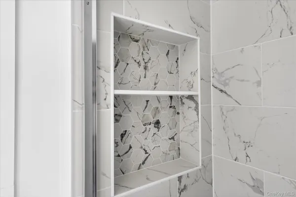 a bathroom with a bathtub and shower