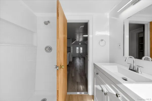 a bathroom with a sink and a mirror