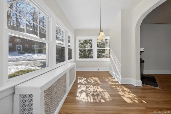 a view of a hallway with windows