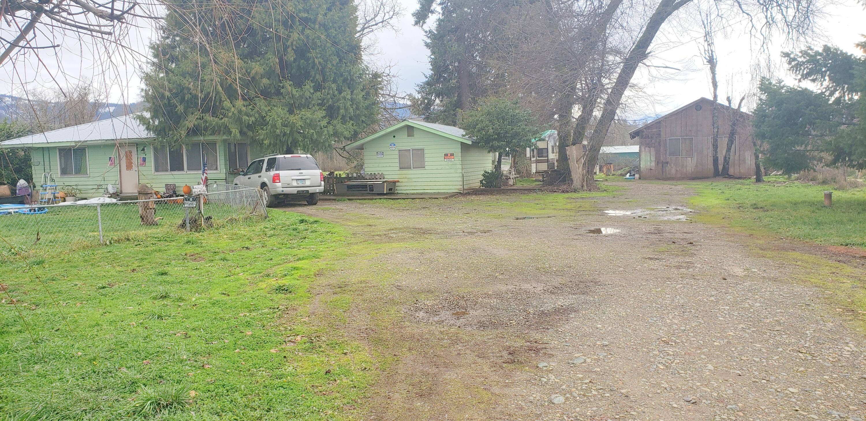 4195 Holland Loop Road Cave Junction, OR 97523 - Photo 1 of 17 a house view with a sitting space