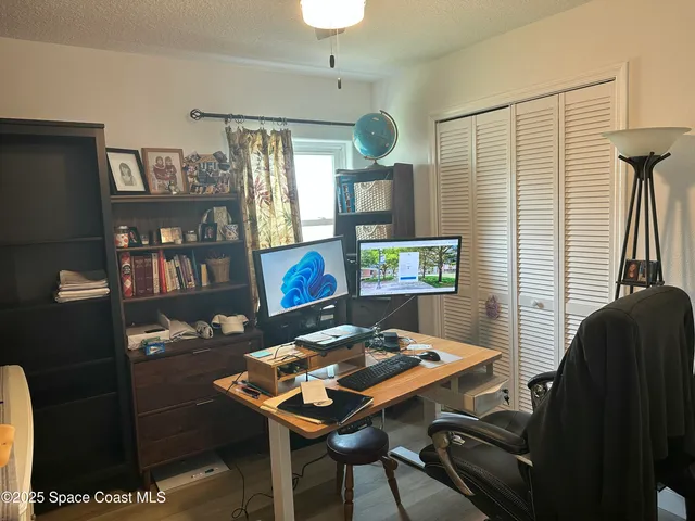 a view of a workspace with furniture
