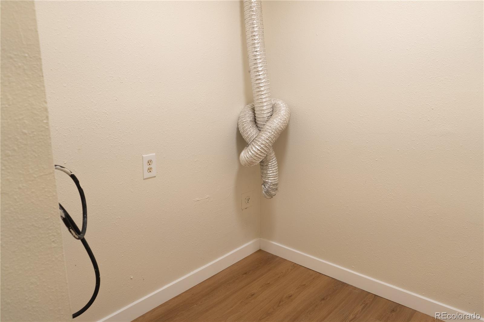 3073 West Center Avenue, Unit C Denver, CO 80219 - Photo 21 of 34 a view of a room with racks on the wall