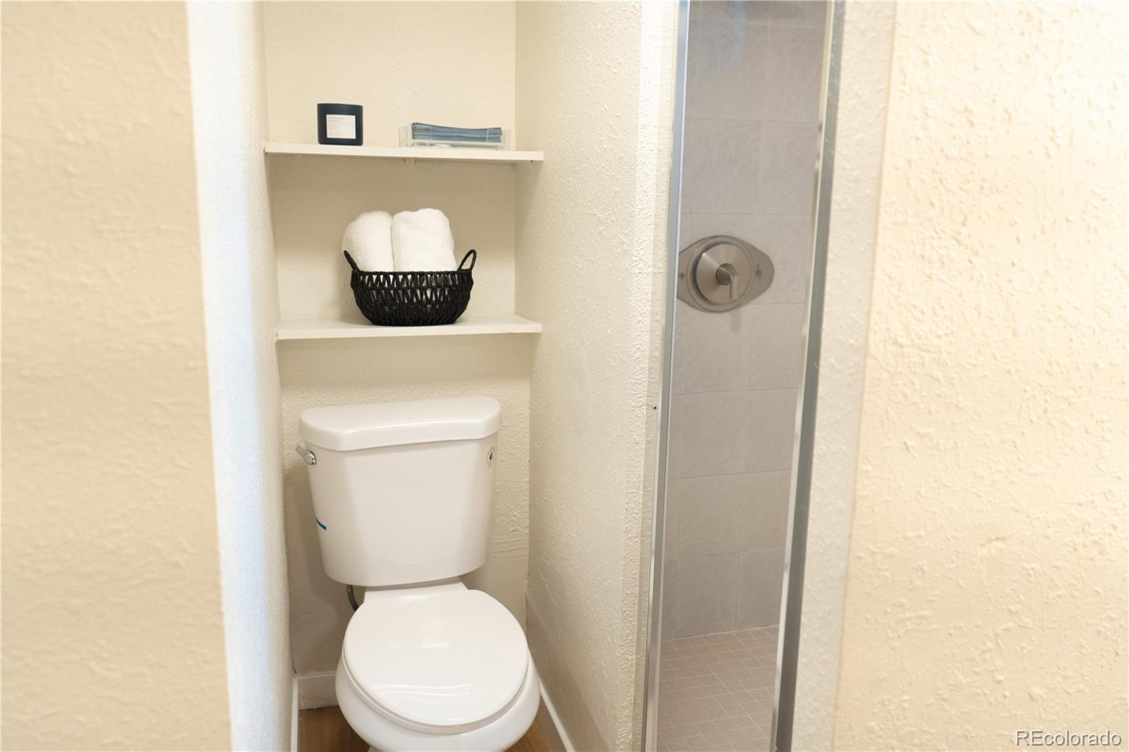 3073 West Center Avenue, Unit C Denver, CO 80219 - Photo 22 of 34 a bathroom with a toilet and a sink