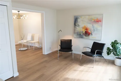 a view of a livingroom with furniture and wooden floor