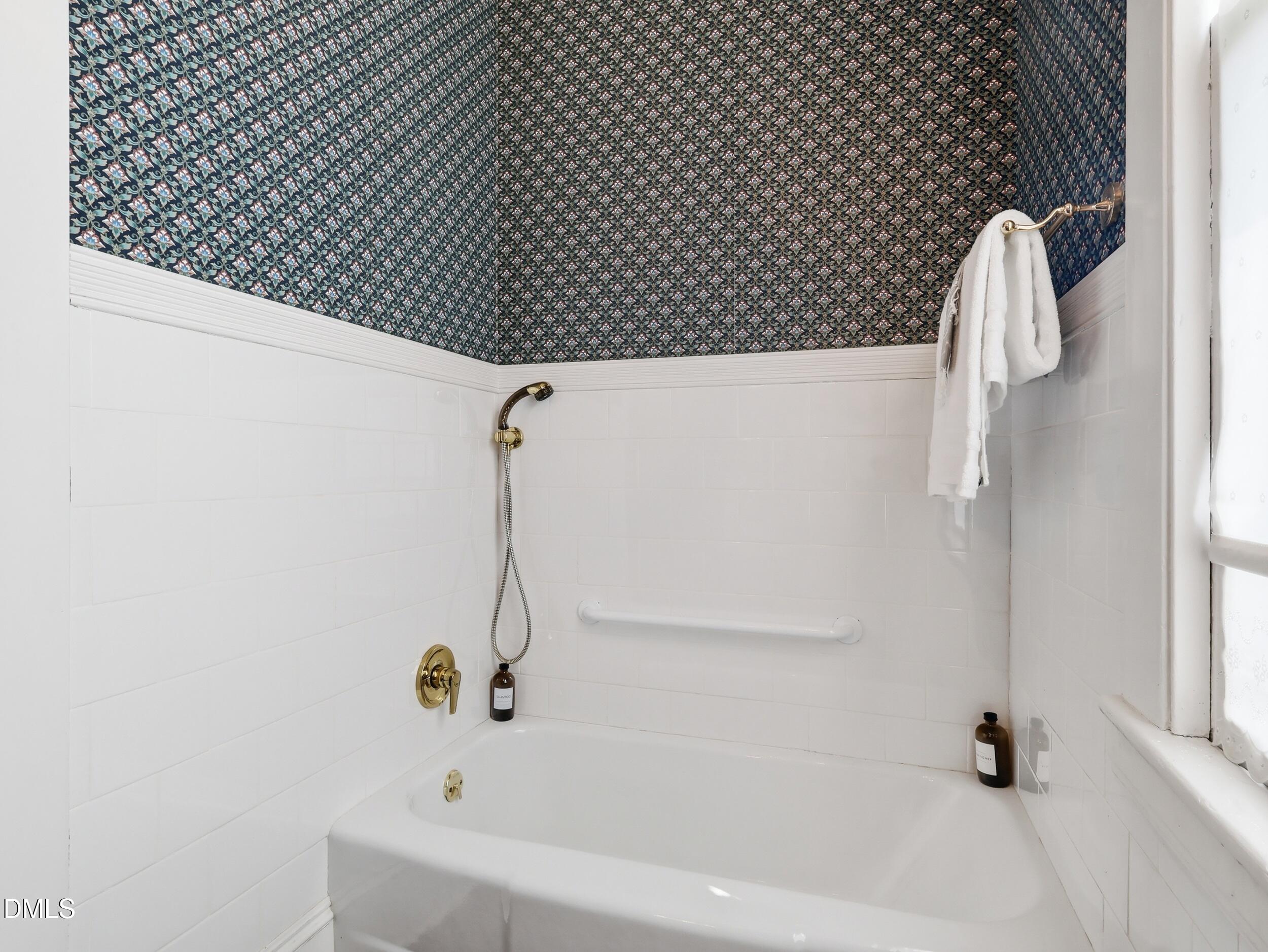 127 Forest Road Raleigh, NC 27605 - Photo 36 of 75 a bathroom with a bathtub