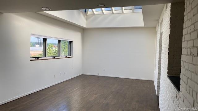 110 Mill Street, Unit 4E Poughkeepsie, NY 12601 - Photo 4 of 7 an empty room with windows