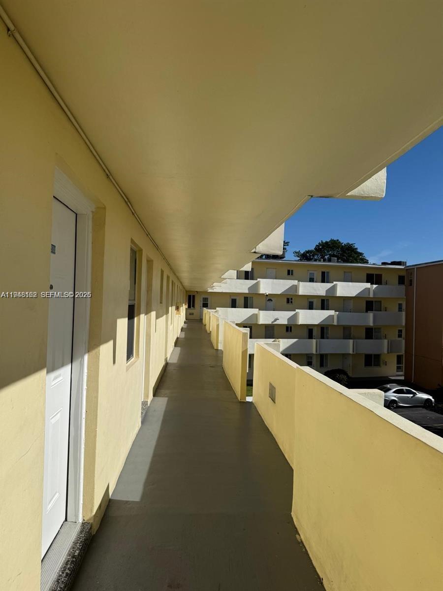 1201 Northeast 191st Street, Unit G313 Miami, FL 33179 - Photo 2 of 15 a view of a kitchen with a stove