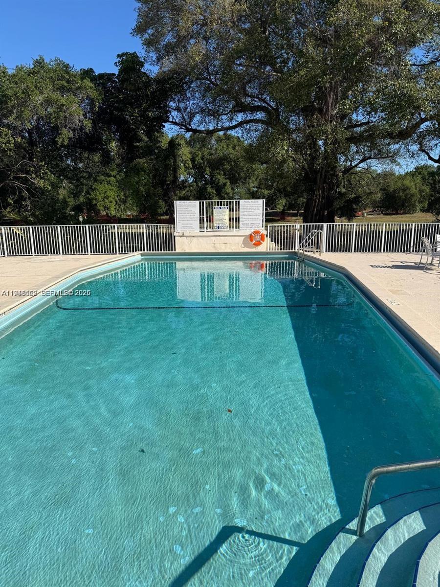 1201 Northeast 191st Street, Unit G313 Miami, FL 33179 - Photo 8 of 15 a view of a back yard