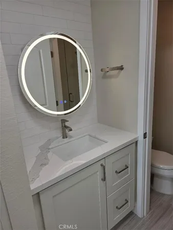 a bathroom with a sink and mirror