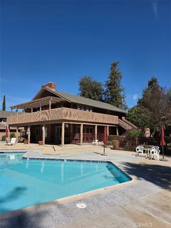 a view of a house with a yard in the background