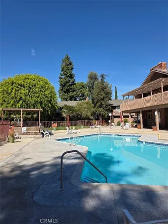 a view of a swimming pool with a patio