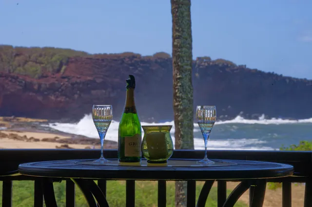 a view of a balcony with two chairs