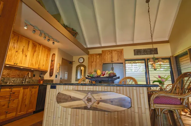 a view of a kitchen area with furniture and windows