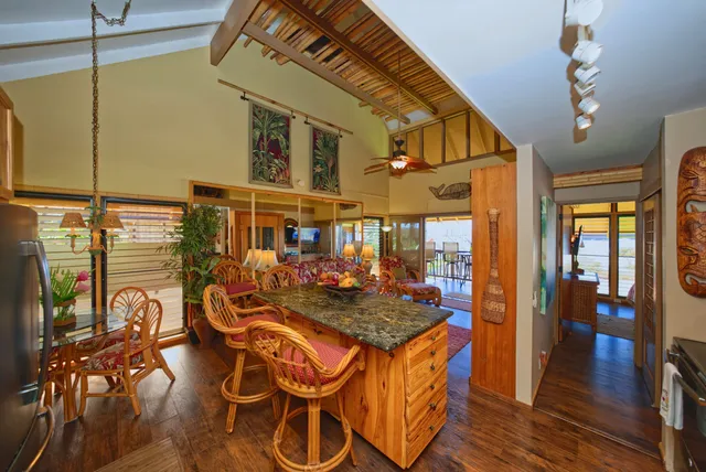 a view of a patio with table and chairs with wooden floor