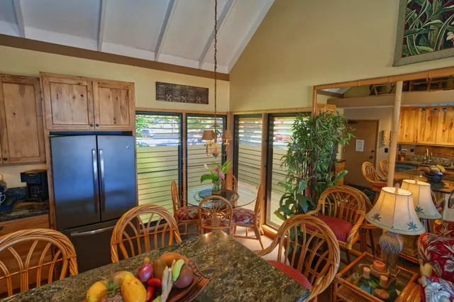 a view of an chairs and table in the kitchen