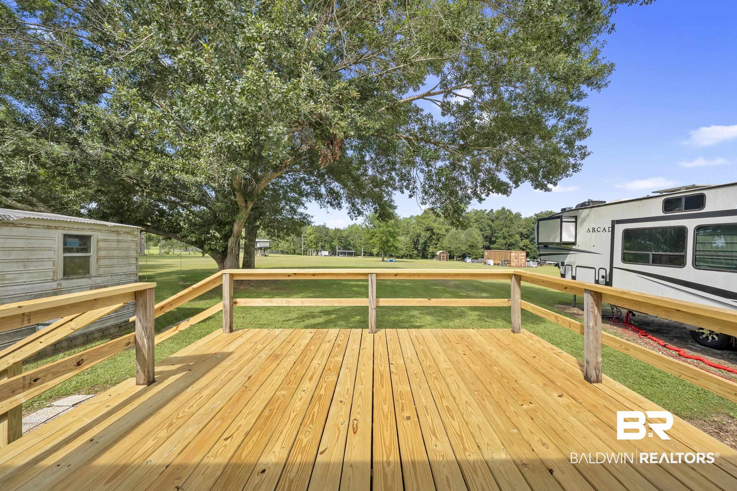 22823 Lanier Road Robertsdale, AL 36567 - Photo 46 of 46 Deck featuring a yard