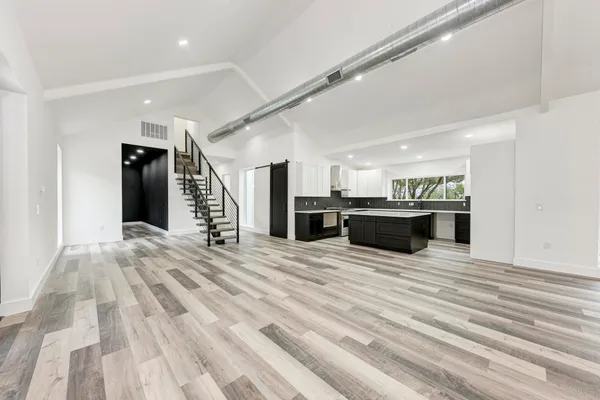 a view of kitchen with furniture and a ceiling fan