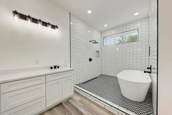 a bathroom with a toilet a sink and bathtub