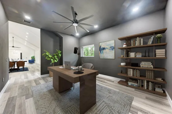 a view of a livingroom with furniture and a bookshelf