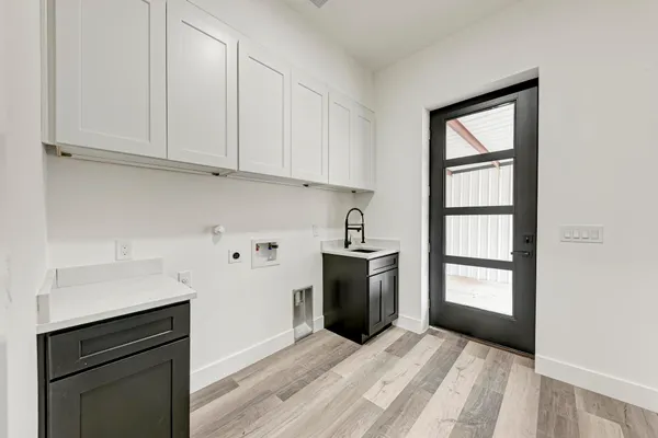 a kitchen with stainless steel appliances granite countertop a refrigerator sink and cabinets