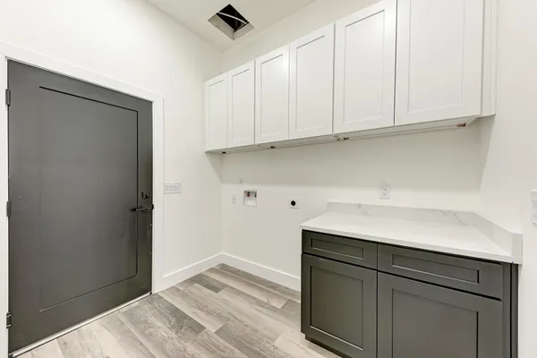 a kitchen with a sink and cabinets