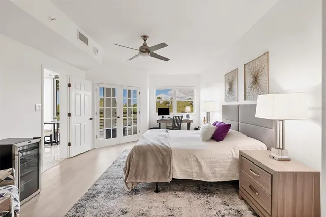 a bedroom with a bed and a lamp