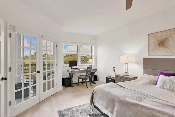 a bed room with a bed and a desk