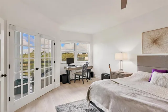 a bed room with a bed and a desk