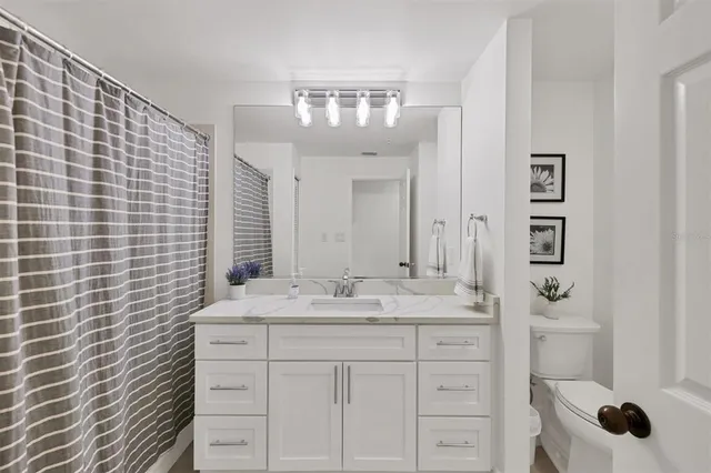 a bathroom with a sink a vanity and a mirror
