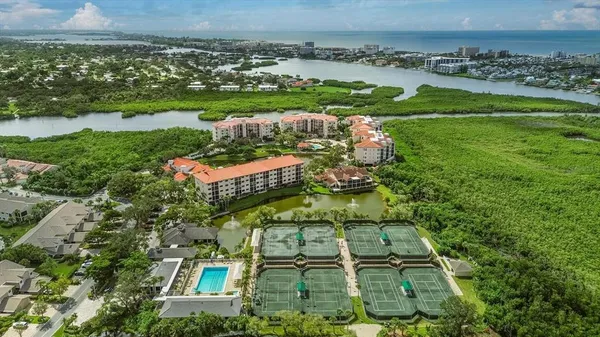 an aerial view of a residential houses with outdoor space