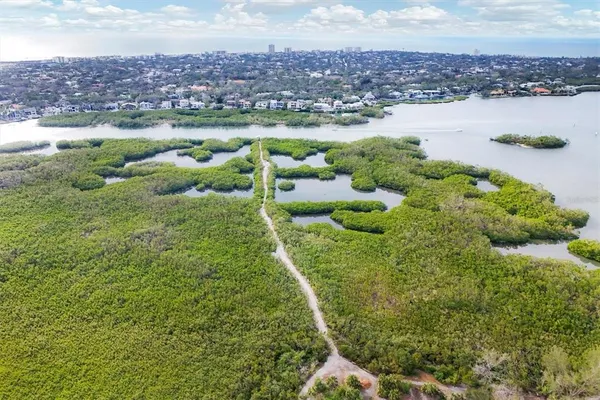 a view of a lake with a yard