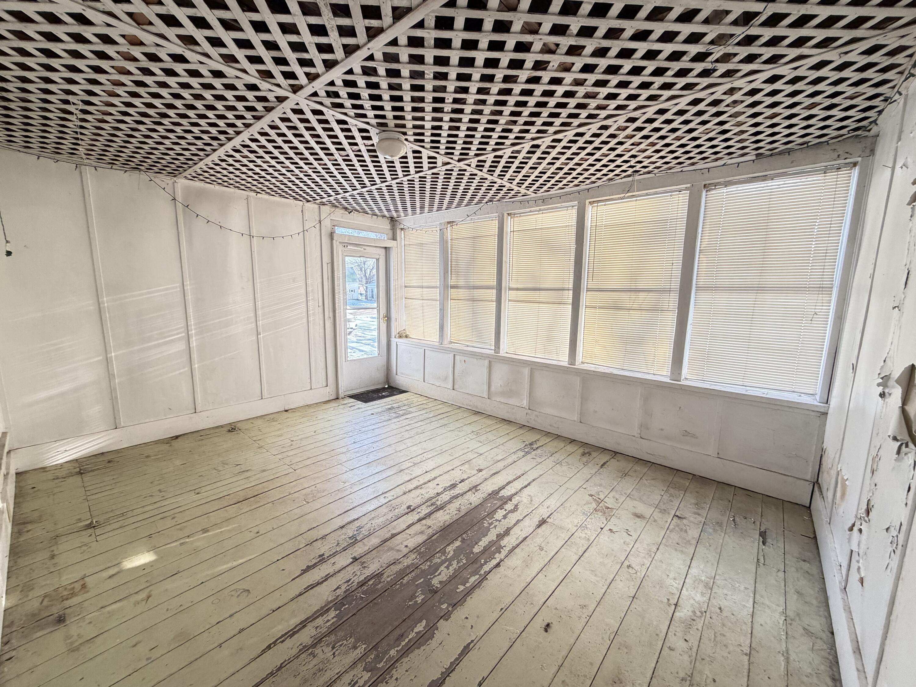 12 Charles Street Milo, ME 04463 - Photo 36 of 40 glassed in porch