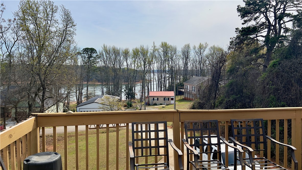 160 Hudgins Lake Road Townville, SC 29689 - Photo 2 of 41 Enjoy tranquil water views and natural surroundings from this welcoming outdoor deck.