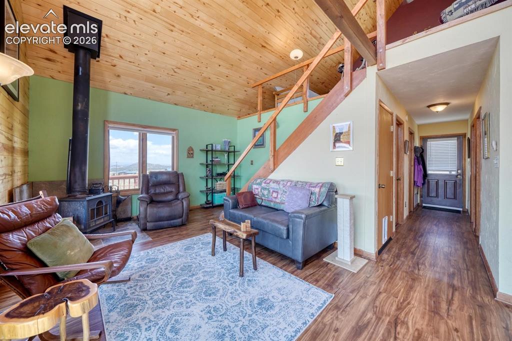 489 Excelsior Road Westcliffe, CO 81252 - Photo 2 of 34 a living room with furniture and wooden floor