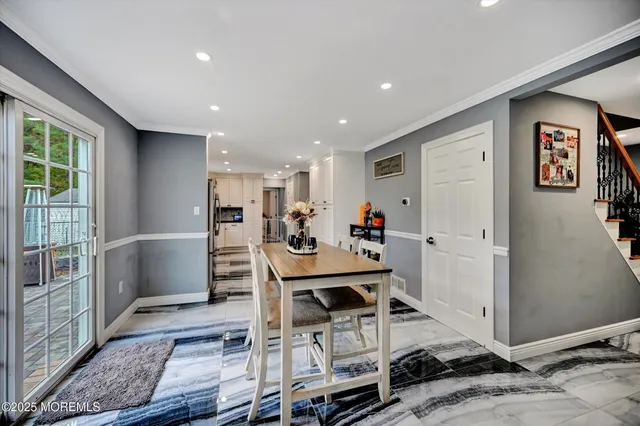 a view of a dining area with furniture window and wooden floor