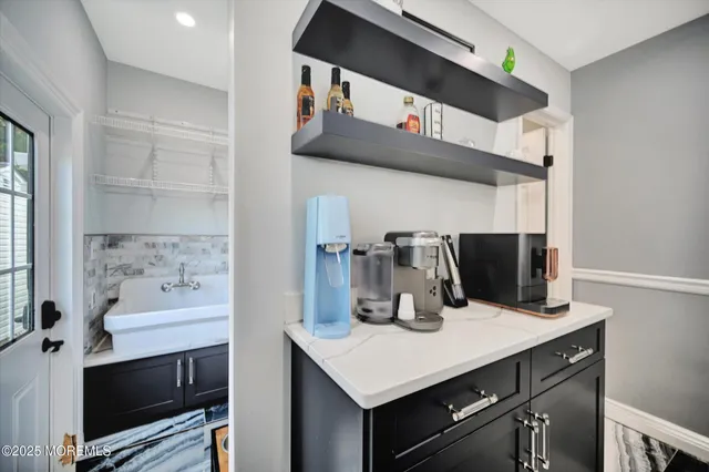 a kitchen with a sink cabinets and appliances
