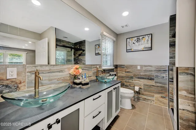 a kitchen with a sink and a stove top oven