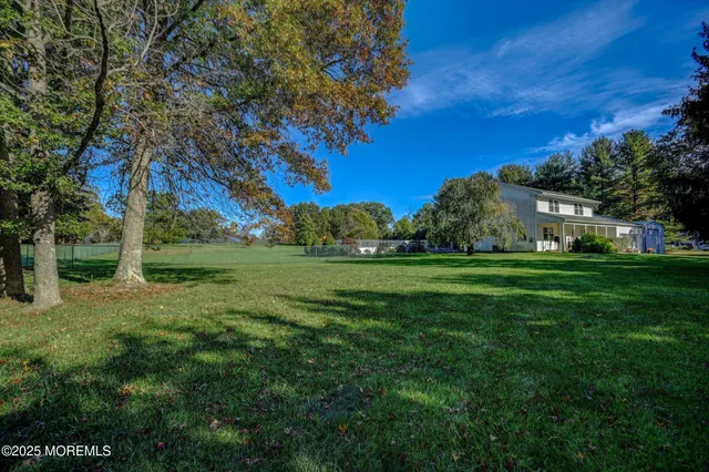 a view of grassy field with trees