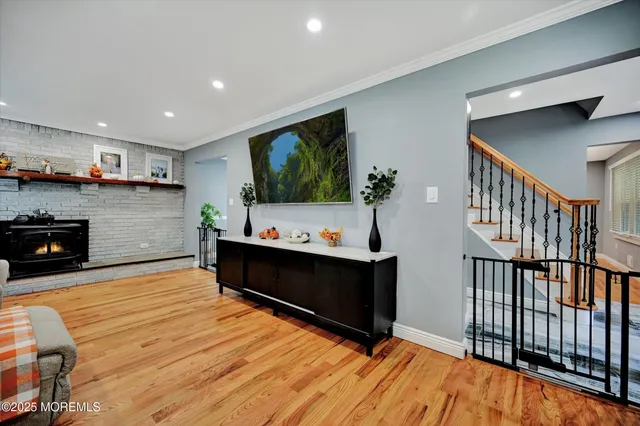 a living room with fireplace furniture and a flat screen tv