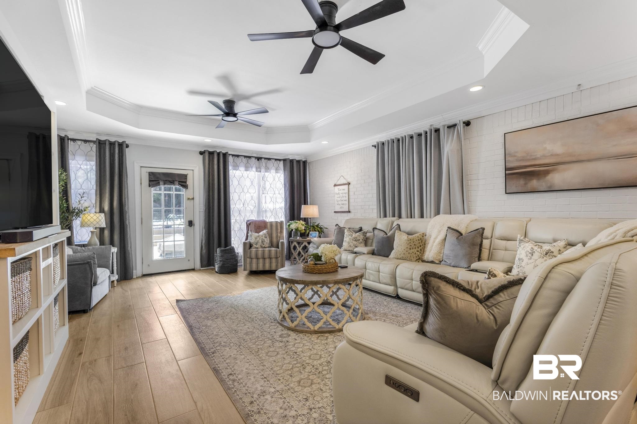 83 Caisson Trace Daphne, AL 36527 - Photo 32 of 63 Spacious interior featuring wood-finish flooring, a tray ceiling with recessed lighting, and dual ceiling fans