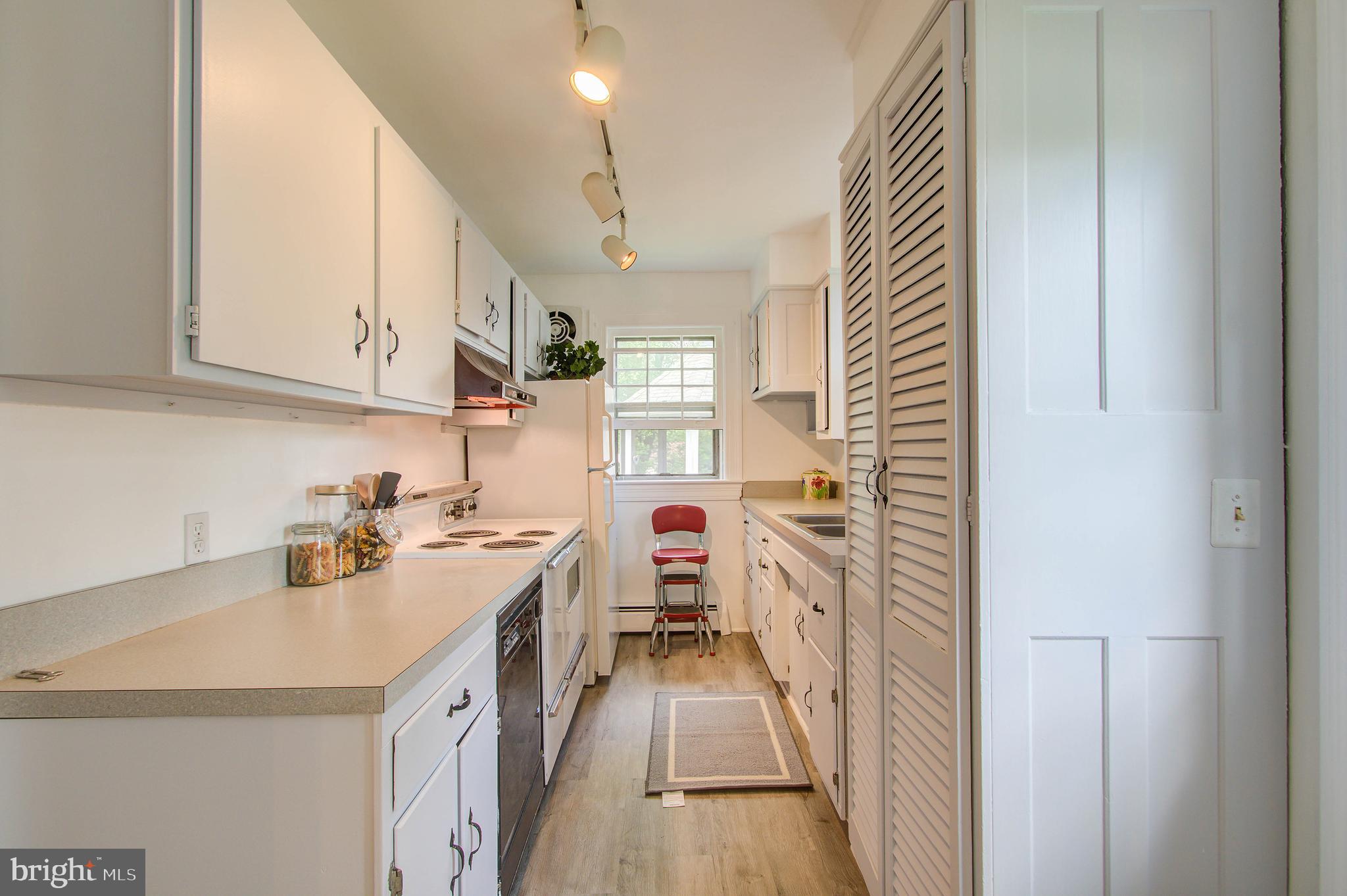 2031 Glen Ross Road Silver Spring, MD 20910 - Photo 14 of 41 Leads to bright kitchen with abundant cabinetry