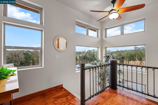 a view of front door and porch with wooden floor